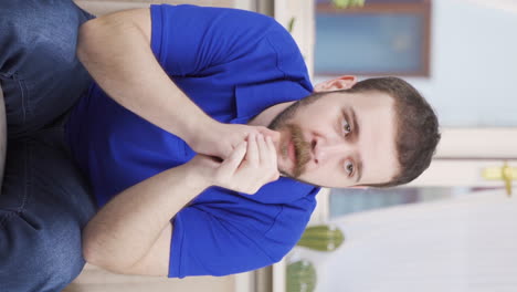 Vertical-video-of-Unhappy-thinking-man.